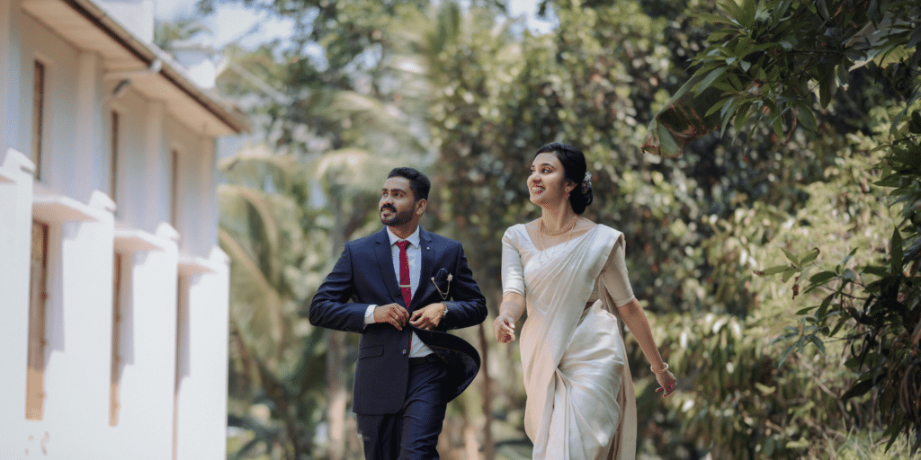 Man and woman walking, dressed in formal attire.